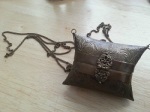 Tiny metal purse